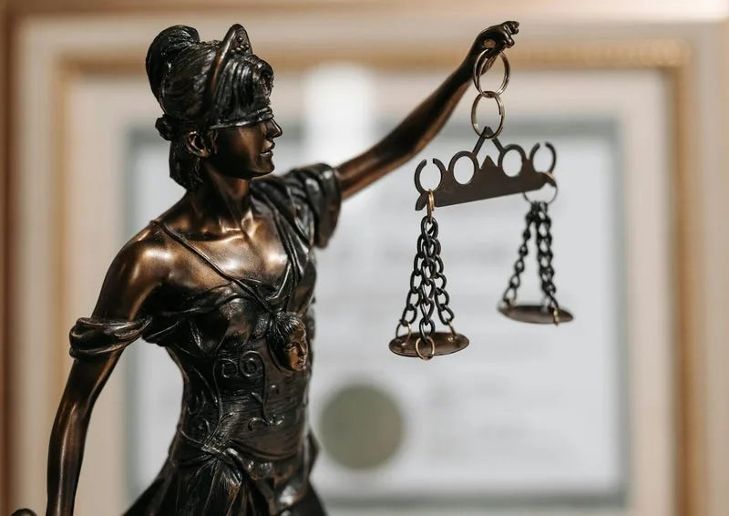 Bronze statue of Lady Justice holding scales