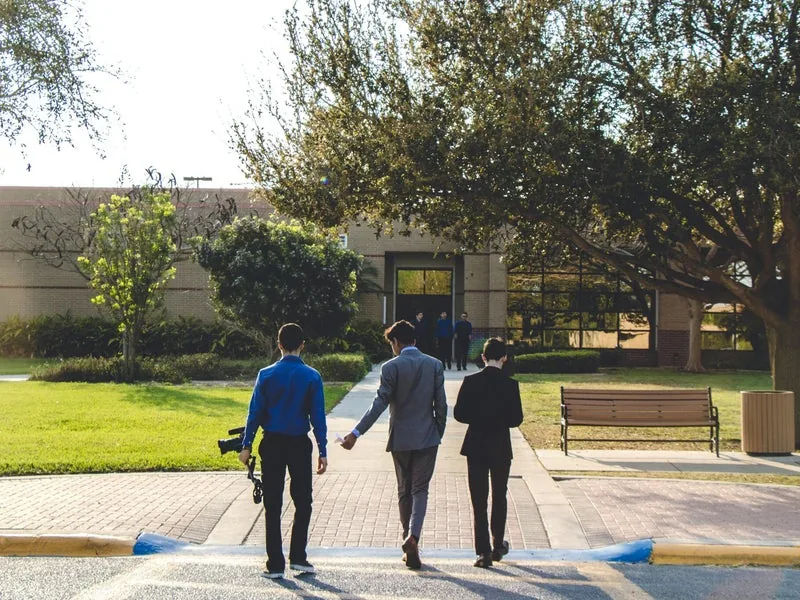 People walking toward a public building
